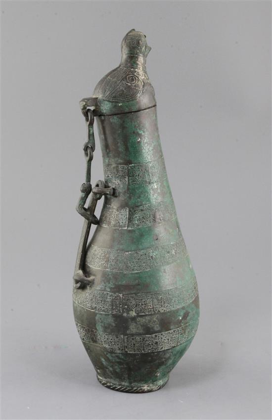 A Chinese archaic bronze flask-shaped ritual wine vessel, Hu, Eastern Zhou dynasty, 5th-4th century B.C., 36.5cm high, hole to base and